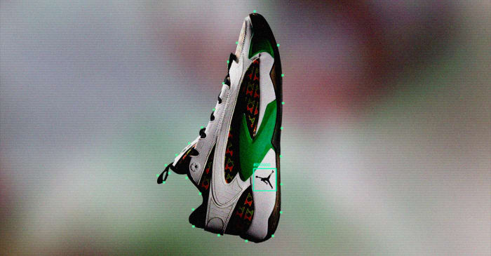 Side view of Luka Doncic's white, black, and green Jordan Brand shoes.